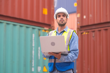 Worker using computer in containers export background, Engineer using computer in containers import...