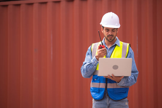 Worker using computer in containers export background, Engineer using computer in containers import background