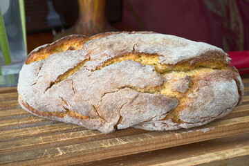 Cornbread on a wooden bread bin. piece of cornbread in a bakery