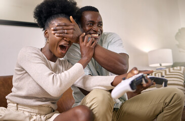 Play video games, dont play me. Shot of a young couple playing video games at home.