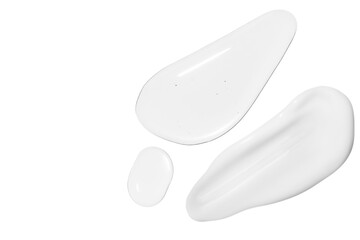 Drops of transparent gel and a dab of white cosmetic cream. On a white background.
