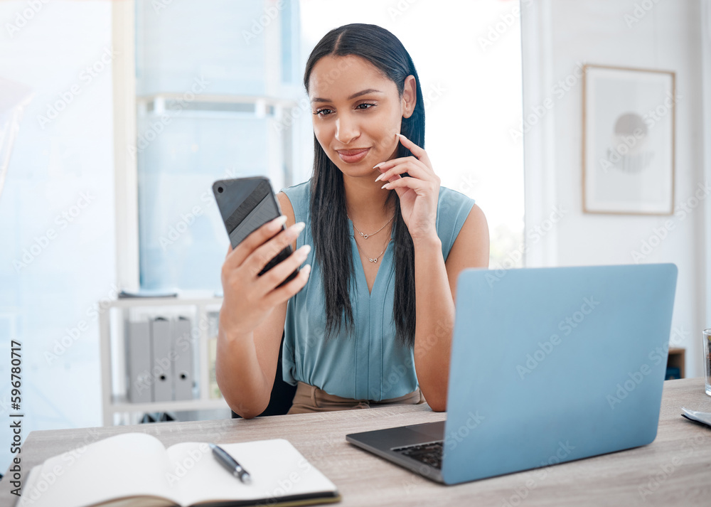 Poster happy young mixed race businesswoman smiling while using a phone and working on a laptop sitting in 