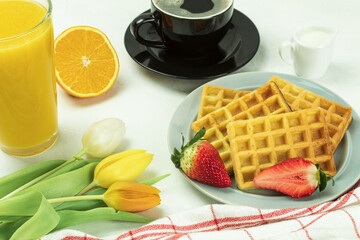 Belgian waffles and fresh fruit for breakfast