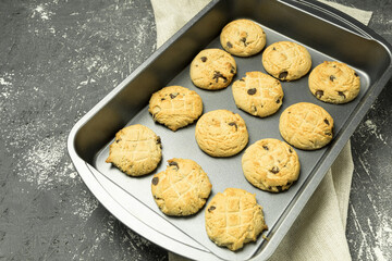 Cookies with chocolate on a baking sheet