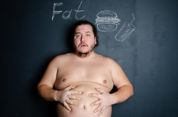 Diet and healthy lifestyle. Funny fat man eating a burger.