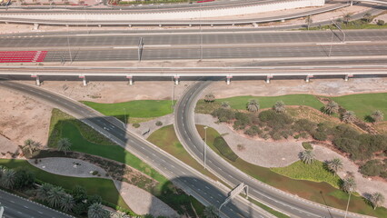 Aerial view on Dubai Marina with big highway intersection timelapse and skyscrapers around, UAE