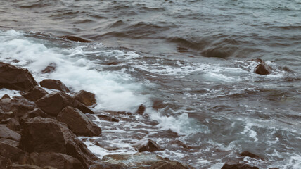 Sea waves with sky and rocks