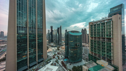 Dubai international financial center skyscrapers aerial night to day timelapse.