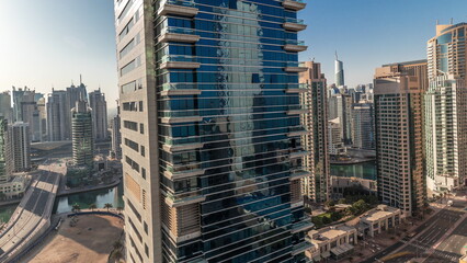 Obraz premium Panoramic view of the Dubai Marina and JBR area and the famous Ferris Wheel aerial timelapse