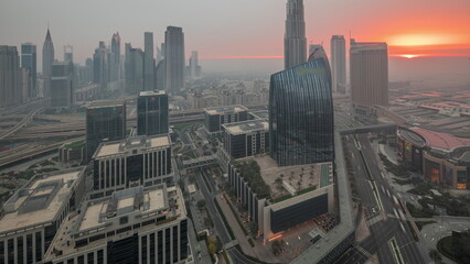 Fototapeta premium Futuristic Dubai Downtown and finansial district skyline aerial night to day timelapse.