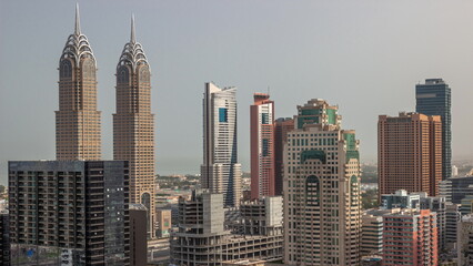 Fototapeta na wymiar Skyscrapers in Barsha Heights district and internet city towers aerial timelapse.