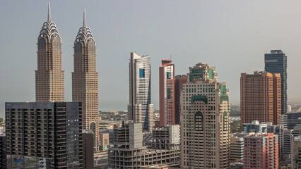 Skyscrapers in Barsha Heights district and internet city towers aerial timelapse.