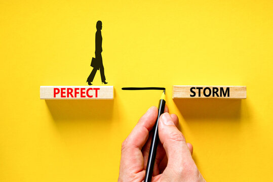 Perfect storm symbol. Concept words Perfect storm on beautiful wooden block. Beautiful yellow table yellow background. Businessman hand. Businesswoman icon. Business Perfect storm concept. Copy space.