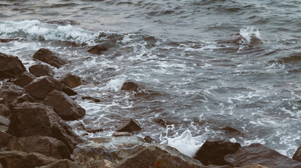 Sea waves with sky and rocks