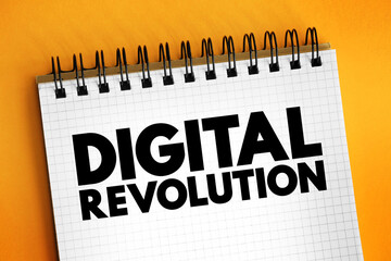 Digital revolution - shift from mechanical and analogue electronic technology to digital electronics, text concept on notepad