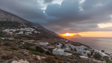Fototapeta premium Panorama showing sunset on Amorgos island aerial timelapse from above. Greece