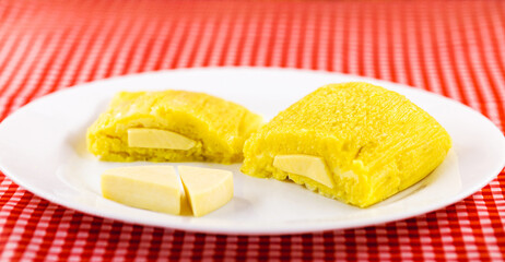 Pamonha, Brazilian sweet corn with cheese filling. Pamonha typical of Brazil, Concept of traditional food. Brazilian food at rural parties in June and July.