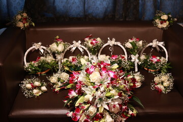multiple colorful wedding bouquets displayed on a table