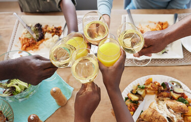 In family life, love is the oil that eases friction. Shot of a unrecognizable family toasting...