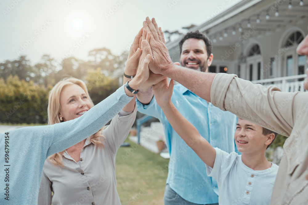 Canvas Prints Support family no matter what. Shot of a family giving each other a high five in the garden at home.