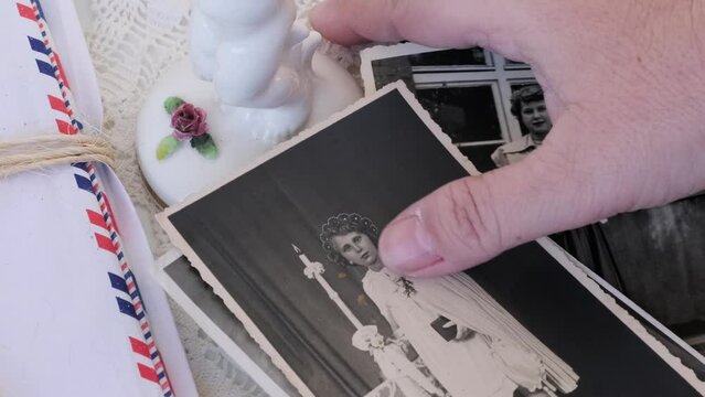 old vintage monochrome photographs, female hands hold retro family photos family archive last century, concept genealogy, memory ancestors, family ties, connection with clan, childhood memories