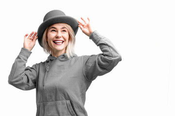 Smiling woman. Beautifu youngl woman wearing gray hat and in a gray sweatshirt.