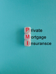 PMI private mortgage insurance symbol. Concept words PMI private mortgage insurance on cubes on a beautiful blue background. Business PMI private mortgage insurance concept. Copy space.