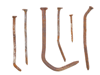 Old deformed and oxidized rusty nails close-up, isolated on transparent background