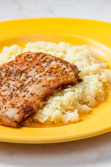 white fish on cumin served with rice