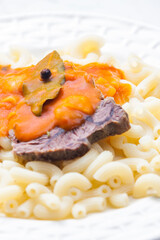 beef meat with tomato sauce and pasta