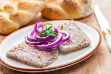 salty jelly called sulc with red and spring onion