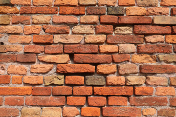 Ancient city wall made with old red bricks