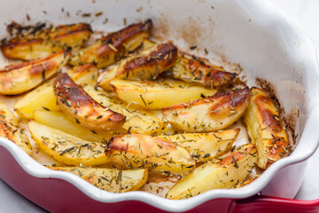 still life of baked potatoes with herbs
