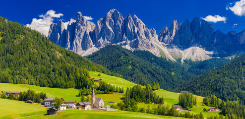 The church of Santa Maddalena and The Odle Mountain Peaks In Background, Panoramic View, Dolomites, Val di Funes, South Tyrol, Italy