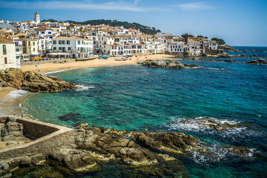 A classic white town on the Costa Brava. White houses, historical buildings of Calella de Palafrugell. Rocks, beach and sea view