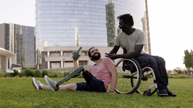 Diverse friends with physical disability having fun at city park during summer vacations