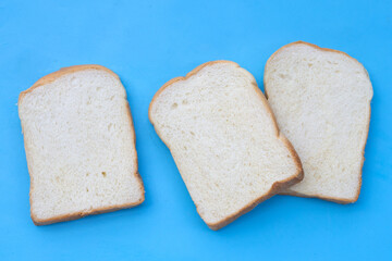 Sliced bread on blue background.