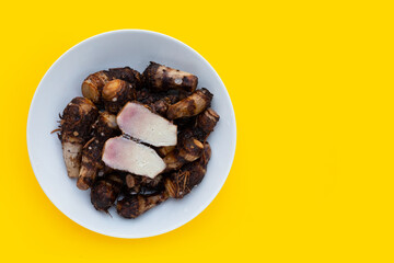 Boiled taro on yellow background.
