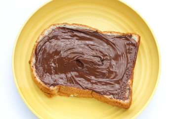 Bread with sweet chocolate hazelnut on white