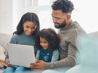 The most important thing in the world is family. Shot of a family using a laptop at home.