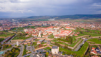 Fototapeta na wymiar Aerial view of the Alba Carolina citadel located in Alba Iulia, Romania. The photography was shot from a drone with the camera level for a panoramic view of the star shaped citadel.