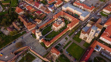 Fototapeta premium Aerial view of the Alba Carolina citadel located in Alba Iulia, Romania. In the photography can be seen the Reunification Cathedral from above, shot from a drone with camera tilted down for a top view