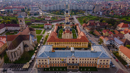 Aerial view of the Alba Carolina citadel located in Alba Iulia, Romania. In the photography can be seen the Reunification Cathedral from above, shot from a drone with camera tilted down for a top view