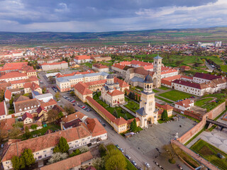 Fototapeta na wymiar Aerial view of the Alba Carolina citadel located in Alba Iulia, Romania. In the photography can be seen the Reunification Cathedral from above, shot from a drone with camera level for a panoramic view