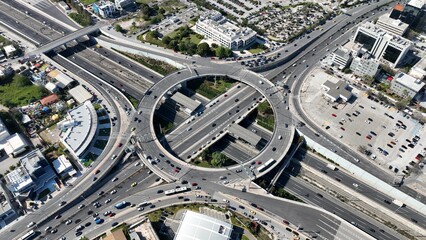 Aerial drone photo of multilevel circular ring road junction passing through urban city centre connecting National motorway and popular avenue