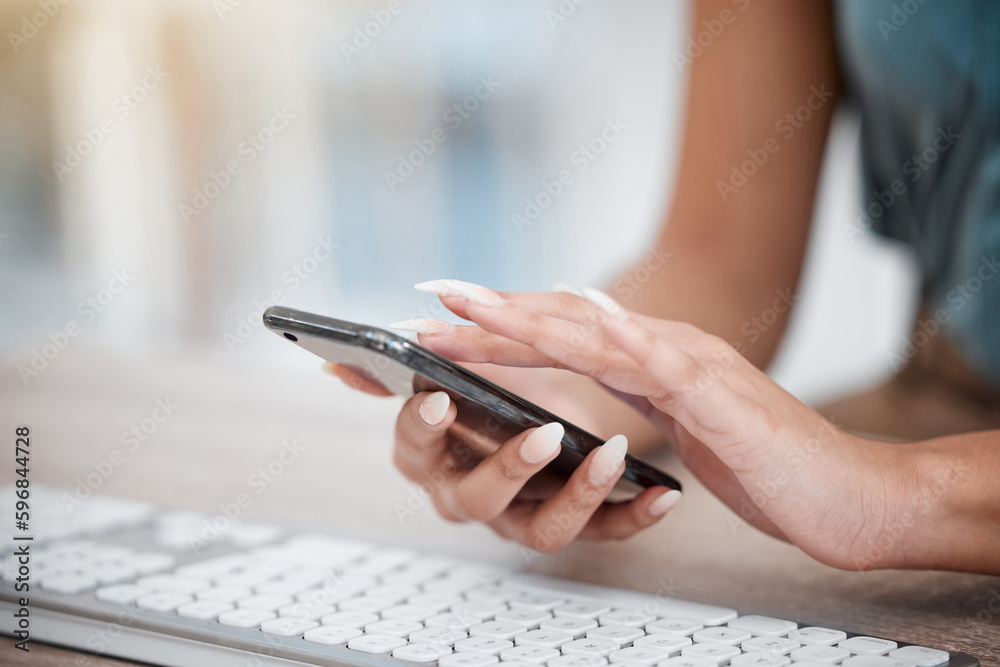 Aufkleber closeup of hands of businesswoman scrolling online apps on her cellphone while sitting at her desk. 