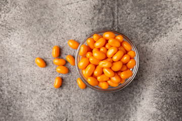 Halloween candy on a black background. coffee corn and sazar skull.Halloween holiday background with jack o lantern pumpkin, candy corn and decorations.Top view.Flat lay. Place for text.