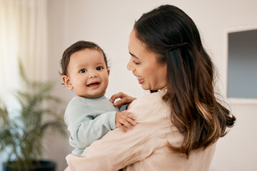 Nothing is better than loving and being loved. Shot of a young mother bonding with her adorable baby at home.