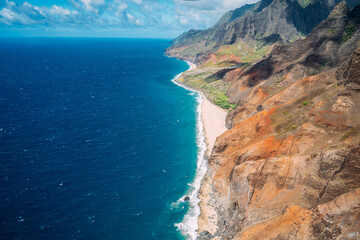 Kauai Napali Coast aerial view from Helicopter tour, golden hour © Fen