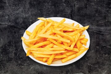 Roasted tasty fry potatoes on desk